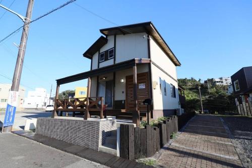 a small house on the side of a street at 白浜ホープヒルズ　G-63 in Shirahama