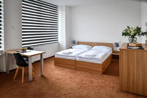 Postel nebo postele na pokoji v ubytování Hotel Fabrika