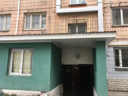 a front door of a house with a green at Babylon Apartments on Era 2 in Rivne