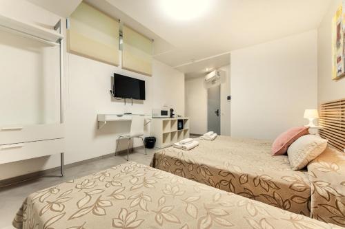 Posteľ alebo postele v izbe v ubytovaní Vincanto Rooms Old Town