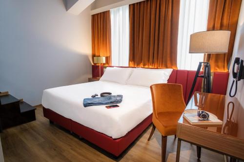 Ένα ή περισσότερα κρεβάτια σε δωμάτιο στο Hotel Della Piana