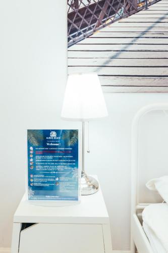 a table with a lamp on it next to a bridge at Almog Haifa Israel Apartments מגדלי חוף הכרמל in Haifa