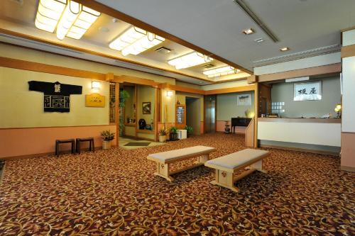a lobby with two benches and a waiting room at Yumoto Itaya in Nikko