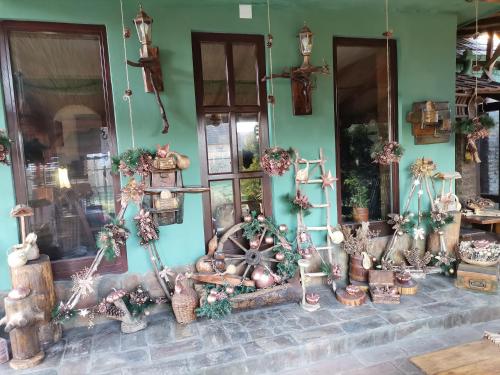 a store front with christmas decorations on the wall at Etno kuća Teodora in Staji°evo