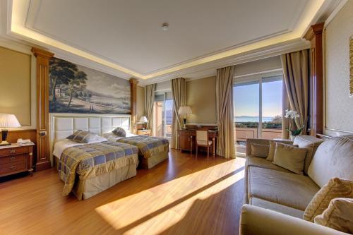 Postel nebo postele na pokoji v ubytování Hotel Splendid