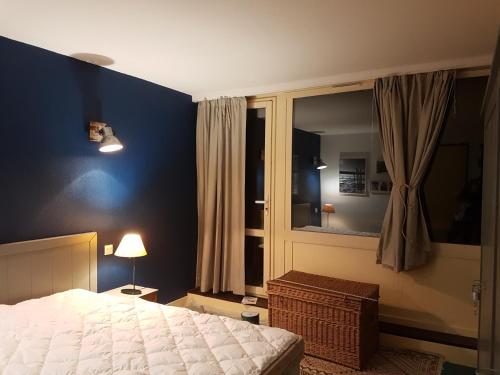Säng eller sängar i ett rum på Appartements Bozeman