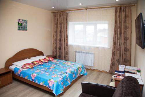 A bed or beds in a room at Studio Apartments on Krasnoarmeiskaya 54