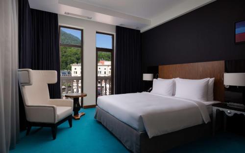 Cama o camas de una habitación en Radisson Rosa Khutor Hotel