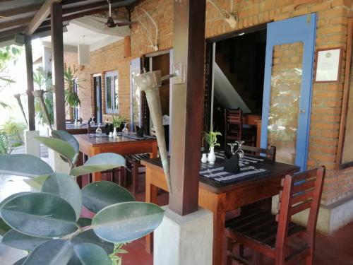 a dining room with a table and chairs at Pavana Hotel in Negombo