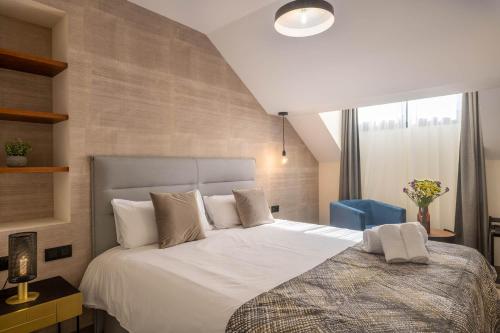 Posteľ alebo postele v izbe v ubytovaní Home Art Apartments Soho