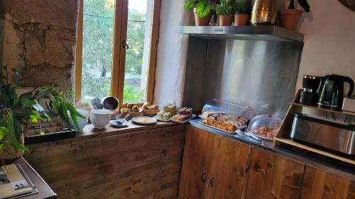 A kitchen or kitchenette at Chambres d'Hôtes Barraconu