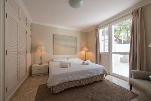 A bed or beds in a room at Casa Maspalomas private pool, Bbq and private parking