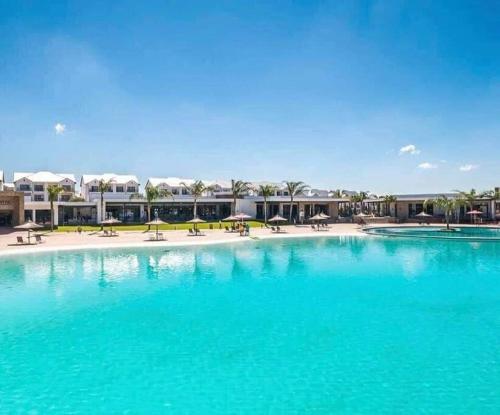 a large pool with blue water in a resort at The Blyde Apartment 1287 in Pretoria