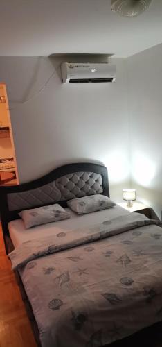 Giường trong phòng chung tại Apartman Stepa