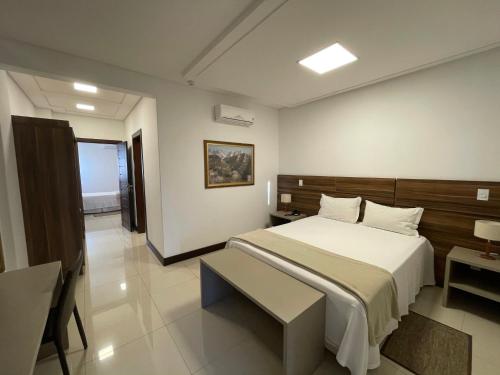 Giường trong phòng chung tại Hotel Dolomiti Caravaggio