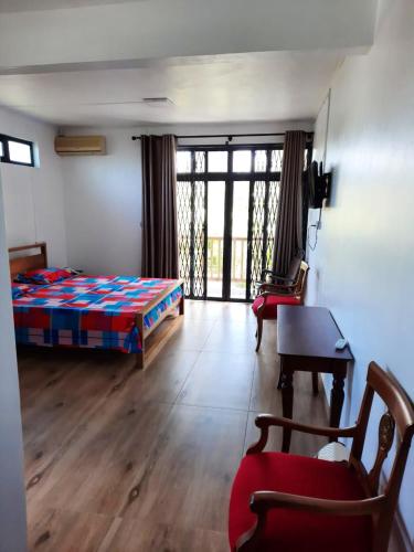 Ένα ή περισσότερα κρεβάτια σε δωμάτιο στο Comfortable apartment in Blue Bay with shared pool