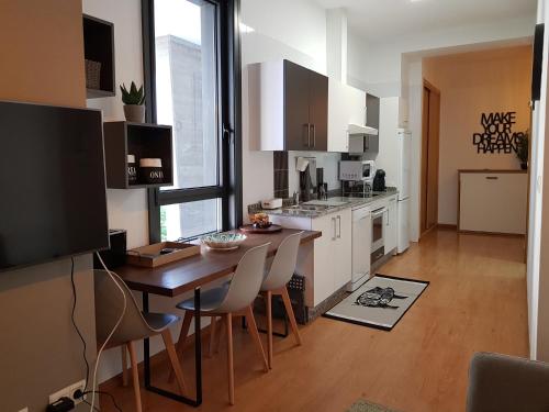 Kuchyň nebo kuchyňský kout v ubytování Apartamento ideal en Vigo