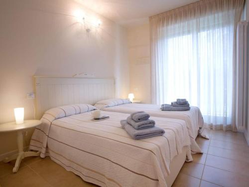 Postel nebo postele na pokoji v ubytování Lenno village Apartment-POOL, PARKING, GARDEN-by Italian Apartments