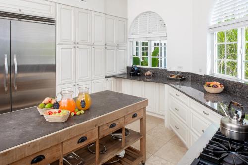 a kitchen with a counter with fruit on it at Le Soleil D'or in Cayman Brac