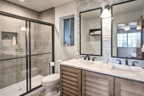 a bathroom with a toilet and a sink and a shower at Luxe Lake Arrowhead Getaway with Treetop Views! in Lake Arrowhead