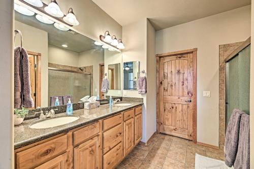 a bathroom with a sink and a large mirror at Show Low Condo Less Than 1 Mi to Torreon Golf Club! in Show Low