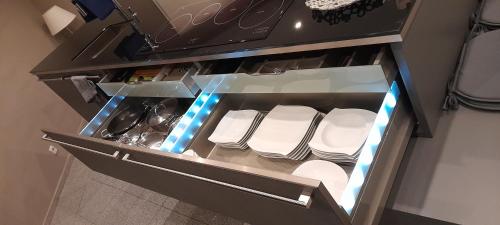 an open refrigerator with white seats in it at Ferienwohnung Alina in Bad Berleburg