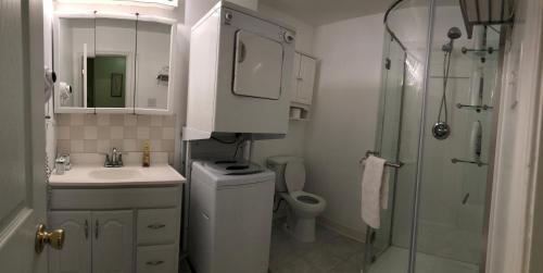 a bathroom with a sink and a toilet and a shower at Single family home in Fort Washington