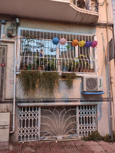 a building with a balcony with umbrellas on it at Best location in İstanbul in Istanbul