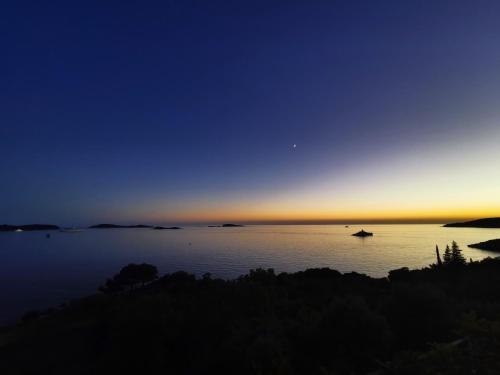 a view of a large body of water at sunset at Holiday Apartment Lira jacuzzi - sea view- terrace in Mlini