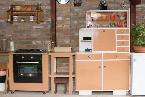 a kitchen with a counter and a stove and a refrigerator at Vesna in Vukovar