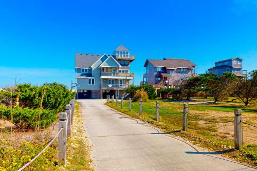 a path leading to some houses on the beach at Play-N-Hooky Too #9-2 in Avon