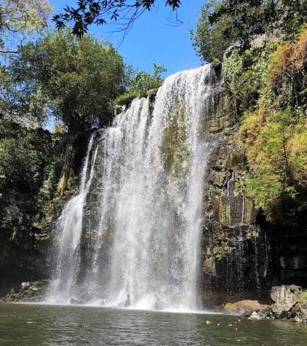 a waterfall in the middle of a body of water at Hostel Dodero in Liberia