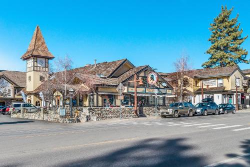 a town with cars parked in front of a building at Tahoe's Stunner in Tahoe Vista