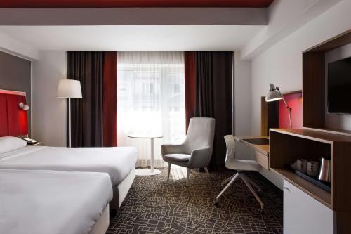 Letto o letti in una camera di Park Inn by Radisson Bucharest Hotel & Residence