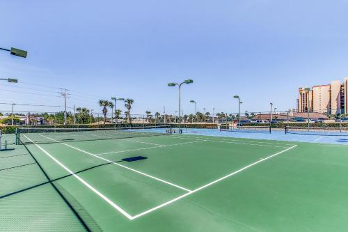 a tennis court with two tennis courts at Phoenix Vacation Rentals in Orange Beach