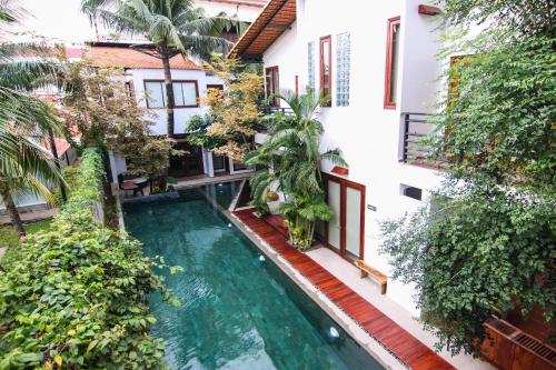 an external view of a house with a swimming pool at Sarina Hotel & Villa in Phnom Penh