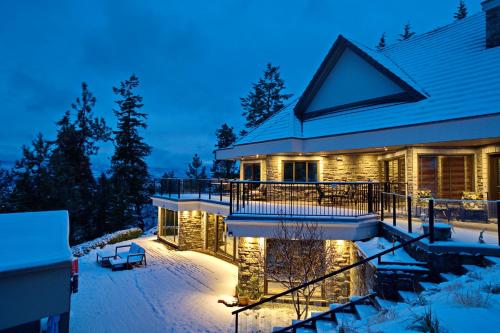 a house in the snow at night at Honeymoon Suite in West Kelowna