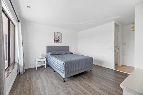 Ένα ή περισσότερα κρεβάτια σε δωμάτιο στο The Harrington Serviced Apartments