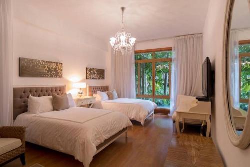 Chic Luxury Condo At Los Altos Casa De Campo 객실 침대