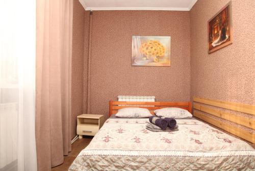 a bedroom with a bed with a backpack on it at Apartment on Frunze 15 in Dnipro