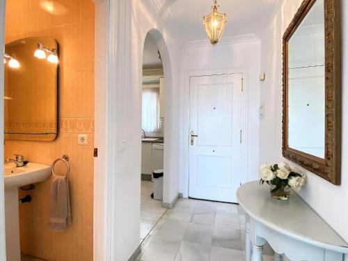 a bathroom with a sink and a mirror at Casa Lindblad Fuentesol 15 Casasol in Nerja