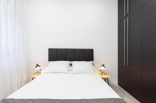 Katil atau katil-katil dalam bilik di Home2Book Stunning Apartment Monterosso