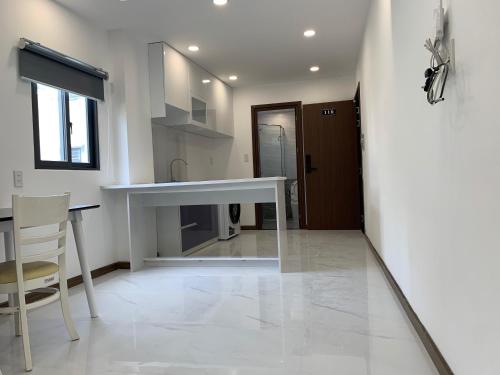 Η κουζίνα ή μικρή κουζίνα στο Smiley Apartment Quận 2