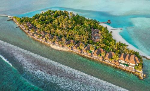 an aerial view of an island in the ocean at Naladhu Private Island Maldives - Special Offer On Transfer Rates For Summer 2024 in South Male Atoll