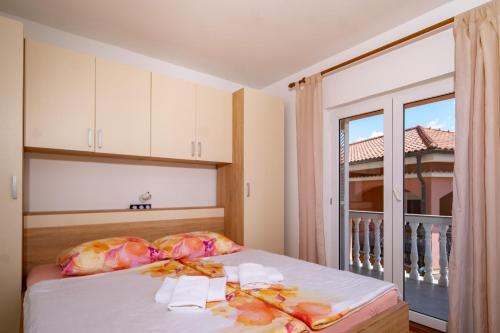 Кровать или кровати в номере Kastell Apartments