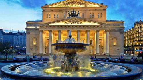 a large building with a fountain in front of a building at Hotel Lime Krasnoselskaya in Moscow