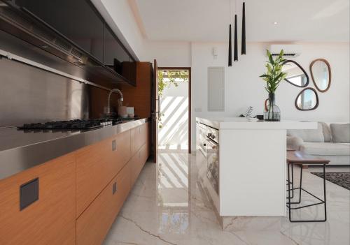 a kitchen with a stove and a counter top at White Pearl in Paphos City