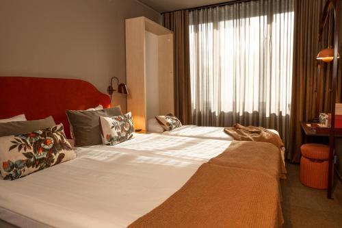 Postel nebo postele na pokoji v ubytování Spar Hotel Majorna