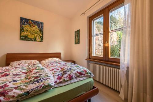 Giường trong phòng chung tại Ferienwohnung Gardasee Castion