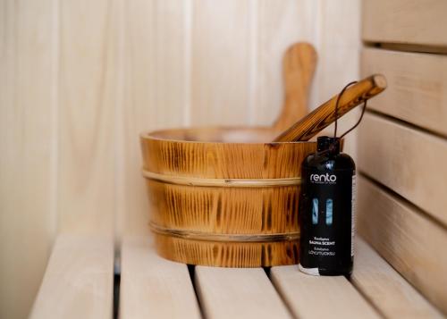 a wooden bowl with a wooden spoon in it at Central Park Home Spa in Arandjelovac